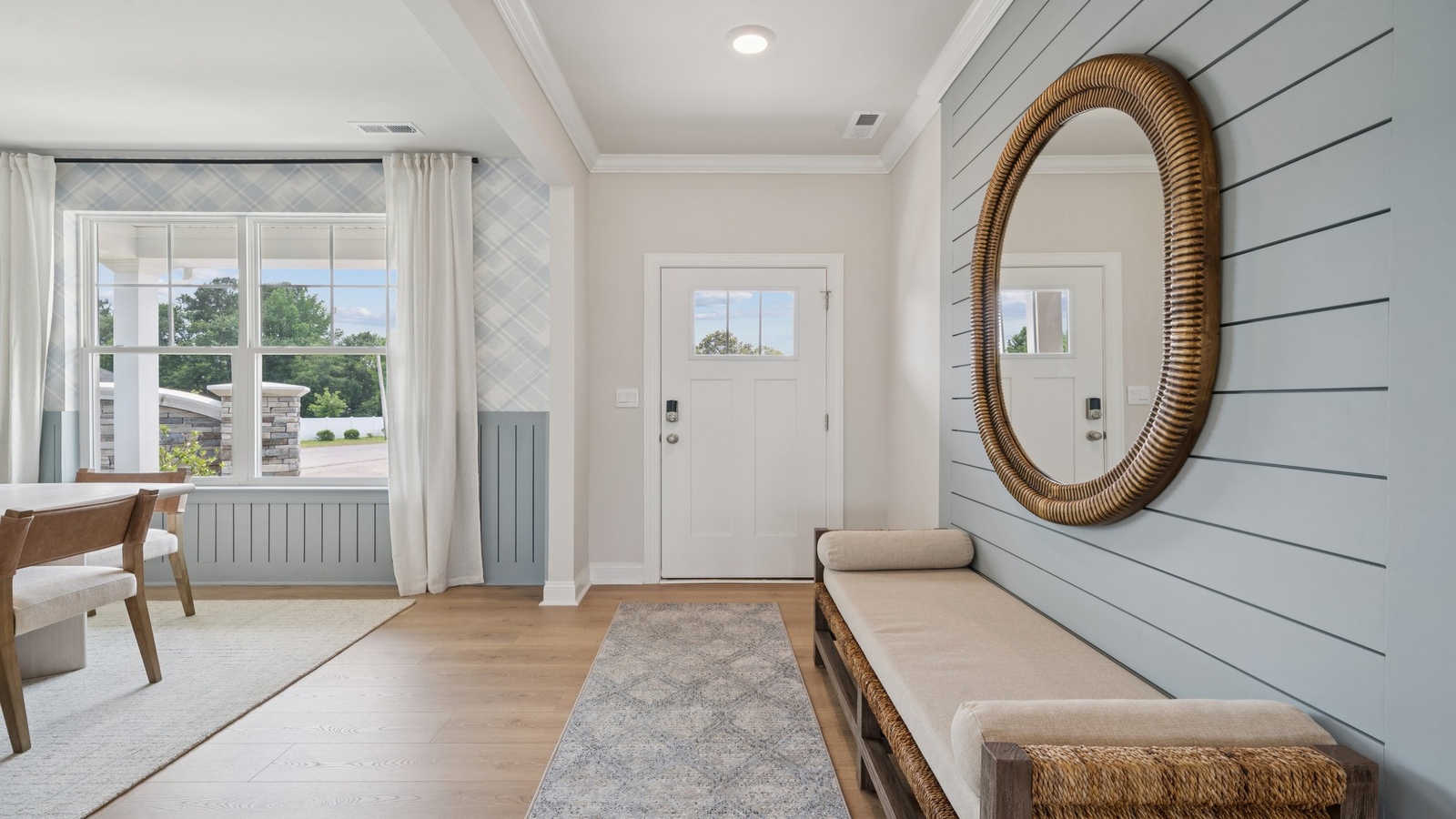 Entry hallway leads from front porch into a Fresh Open Concept designed flex and living spaces Copper Grove at Harpers Mill