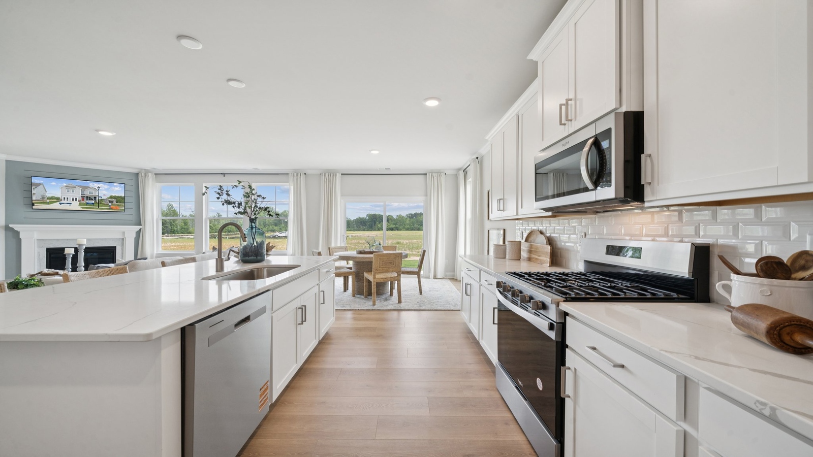 New Build Home includes a kitchen with an expansive island, sleek cabinetry, pantry, new appliance suite