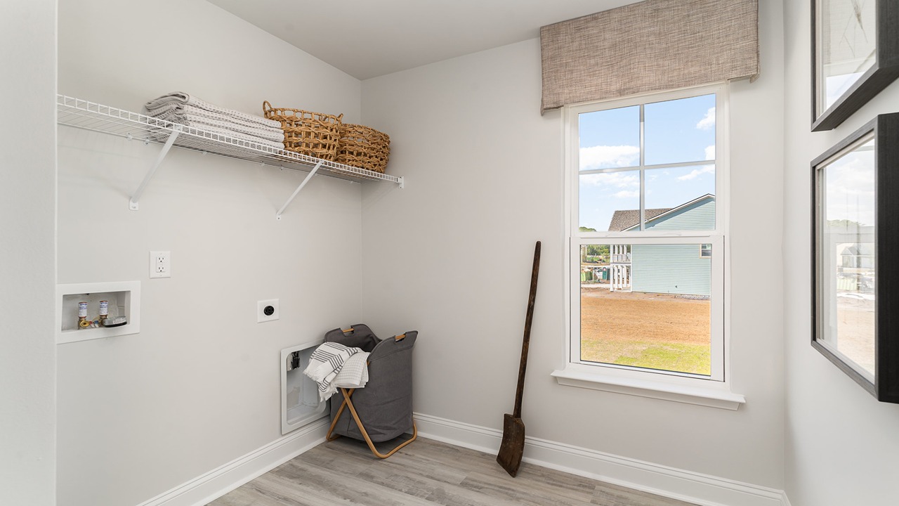 New Construction Home by D.R. Horton includes a private en suite, walk-in shower, hard surface countertops, and ample lighting