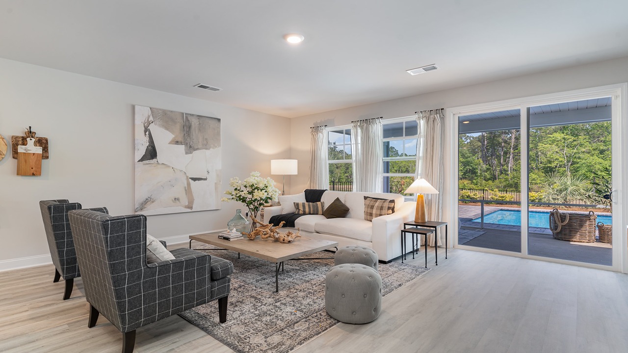 Our modern living room design offers backyard visibility, kitchen and dining connectivity