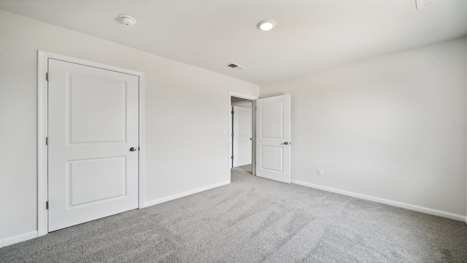 Primary suite at Brewers Meadows South corner window views, walk-through access to en suite bathroom, walk-in closet