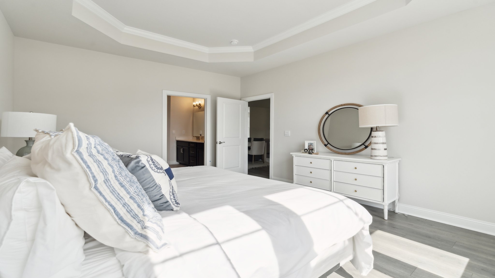 Primary bedroom in this New Home features ample space, double windows, quality carpet, a Walk-in Closet, private En-Suite Bath