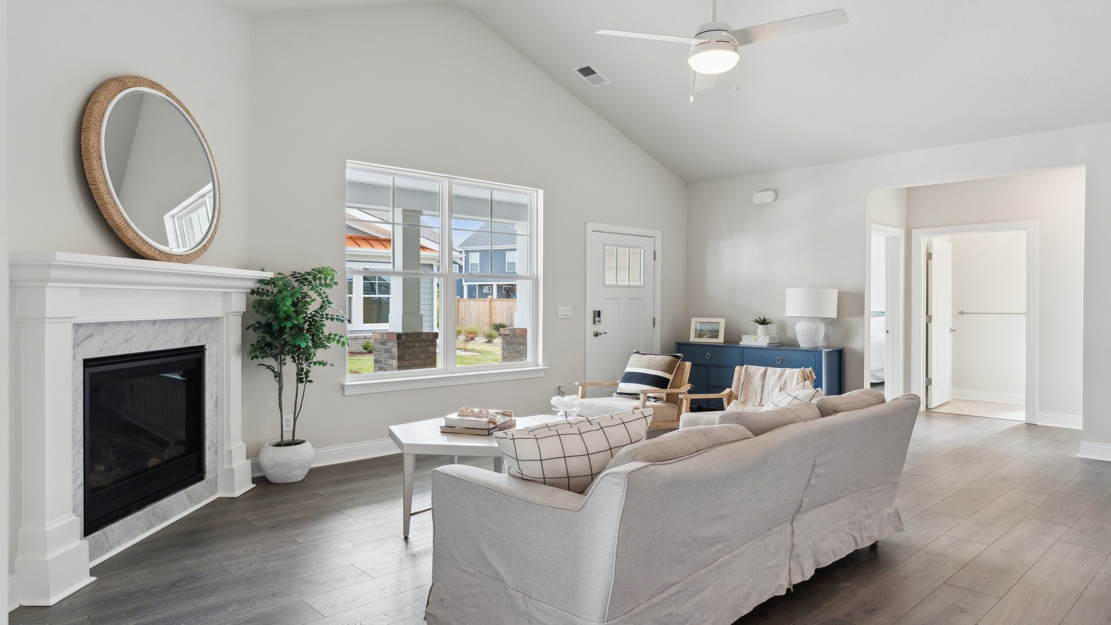 Living room, kitchen, and dining area function as one cohesive main space at Retreat at Edinburgh Farms