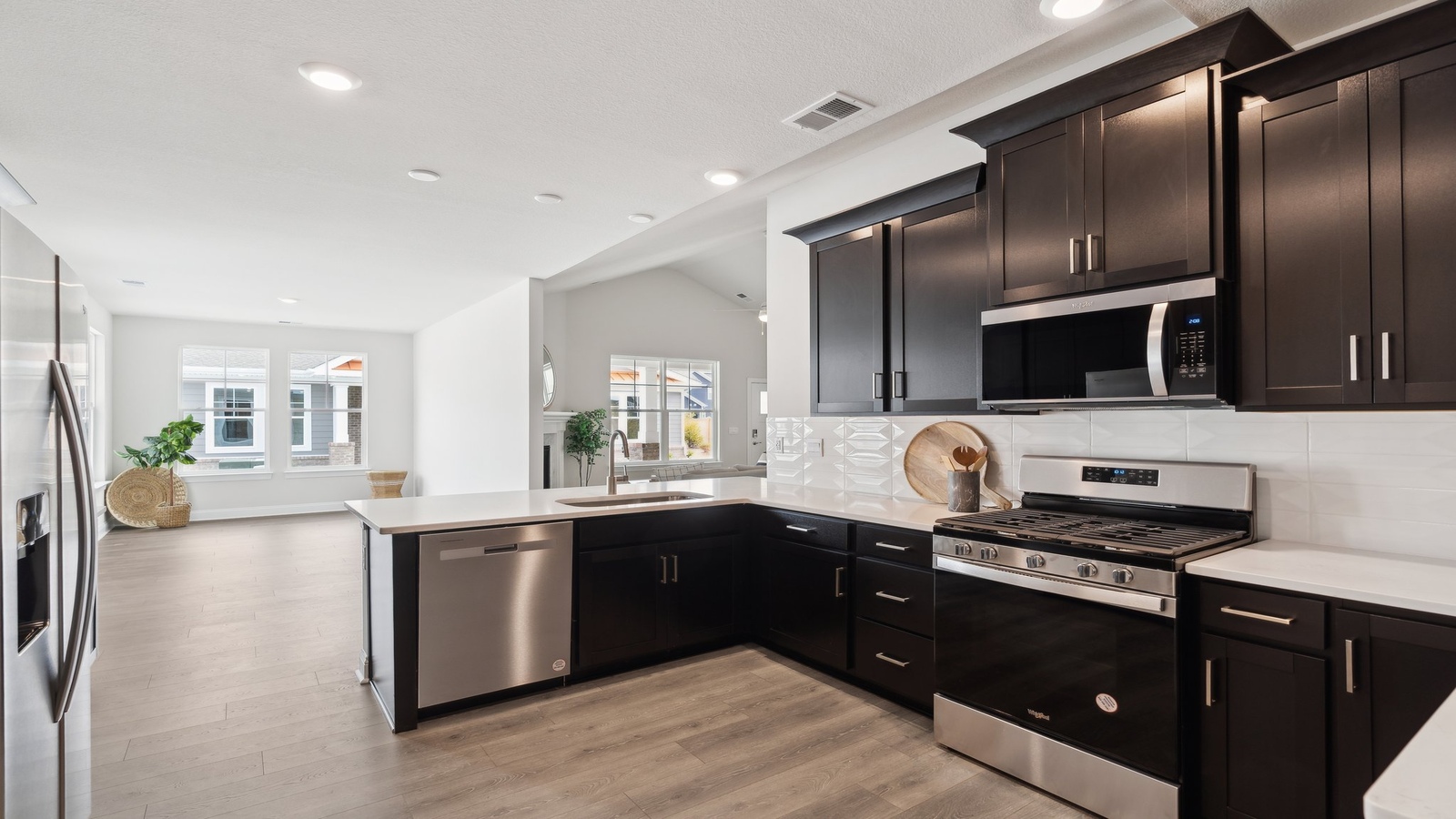 Retreat at Edinburgh Farms's Kitchen island includes a seamless design with dining-living areas in an Open Concept plan