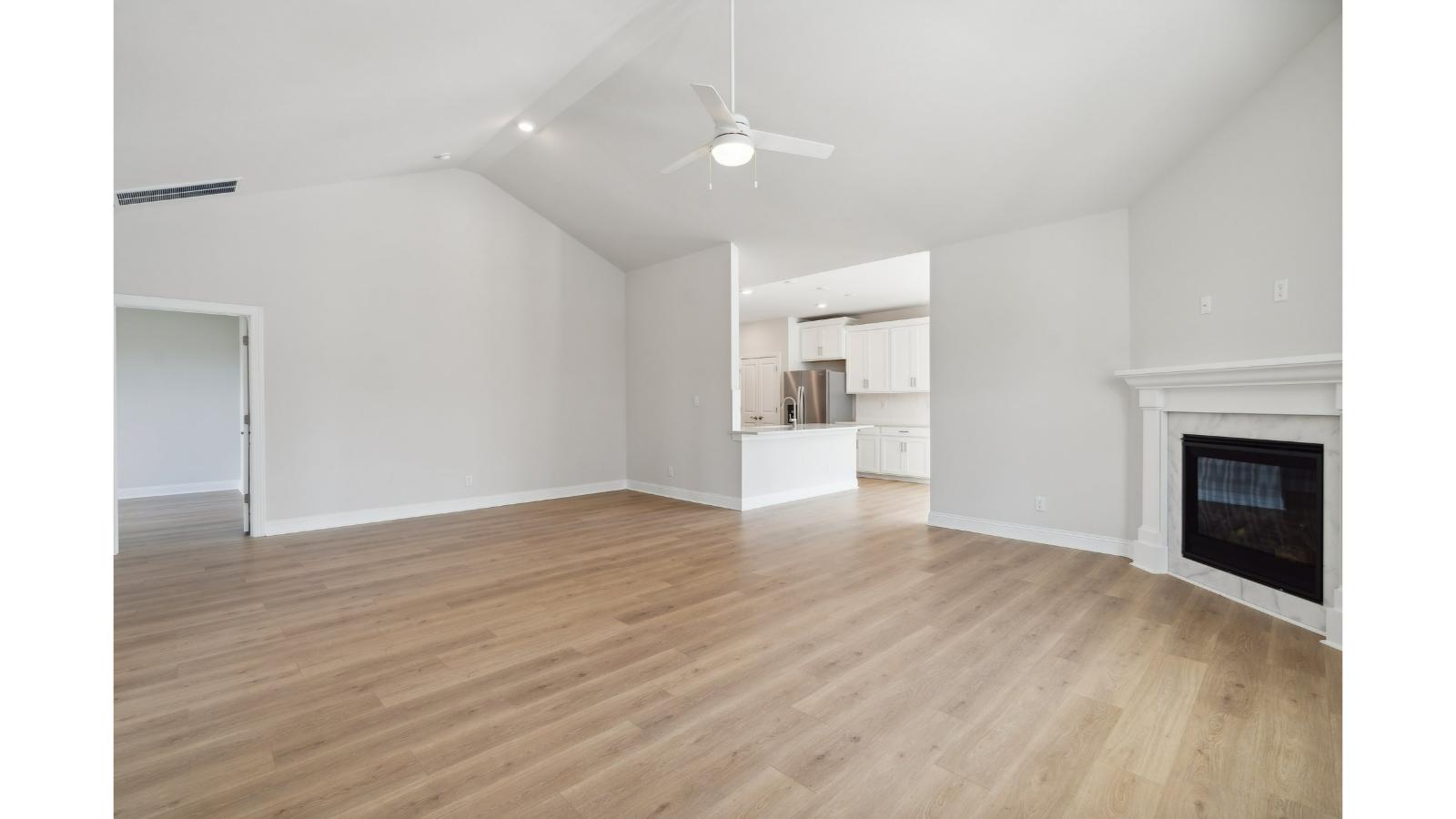Retreat at Edinburgh Farms dining space with electric fireplace, unified kitchen, living room, in one practical main space