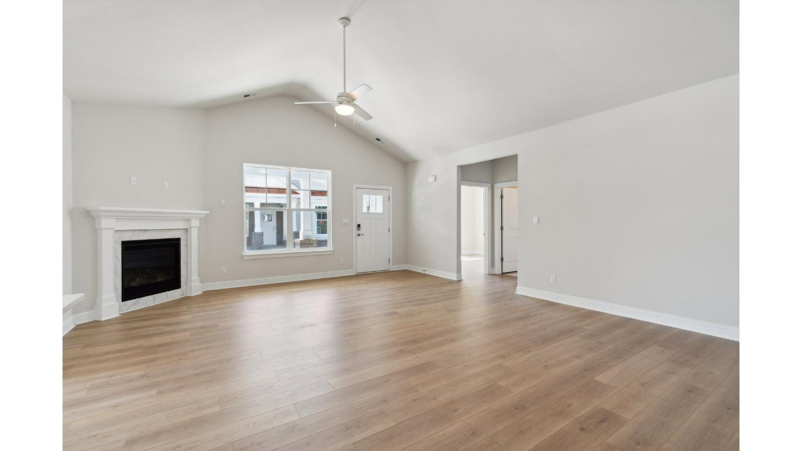 Living room with modern design accents, front views, and convenient traffic flow throughout Retreat at Edinburgh Farms