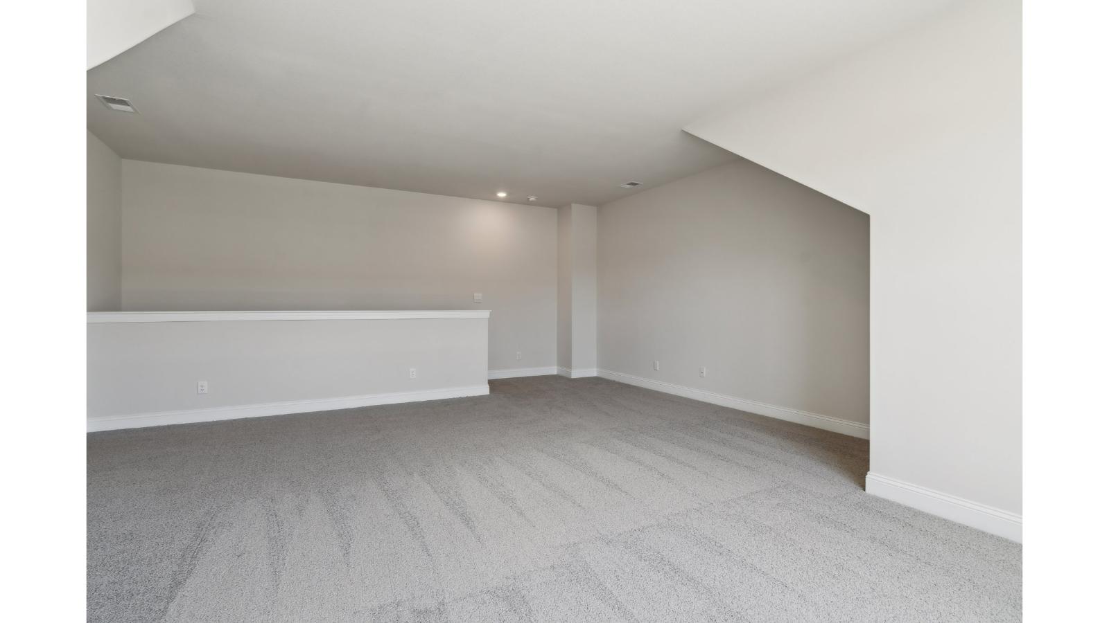 Loft + secondary bedroom with quality carpet, wide landing, stairs, multi-use flowing into secondary bedroom, bathroom