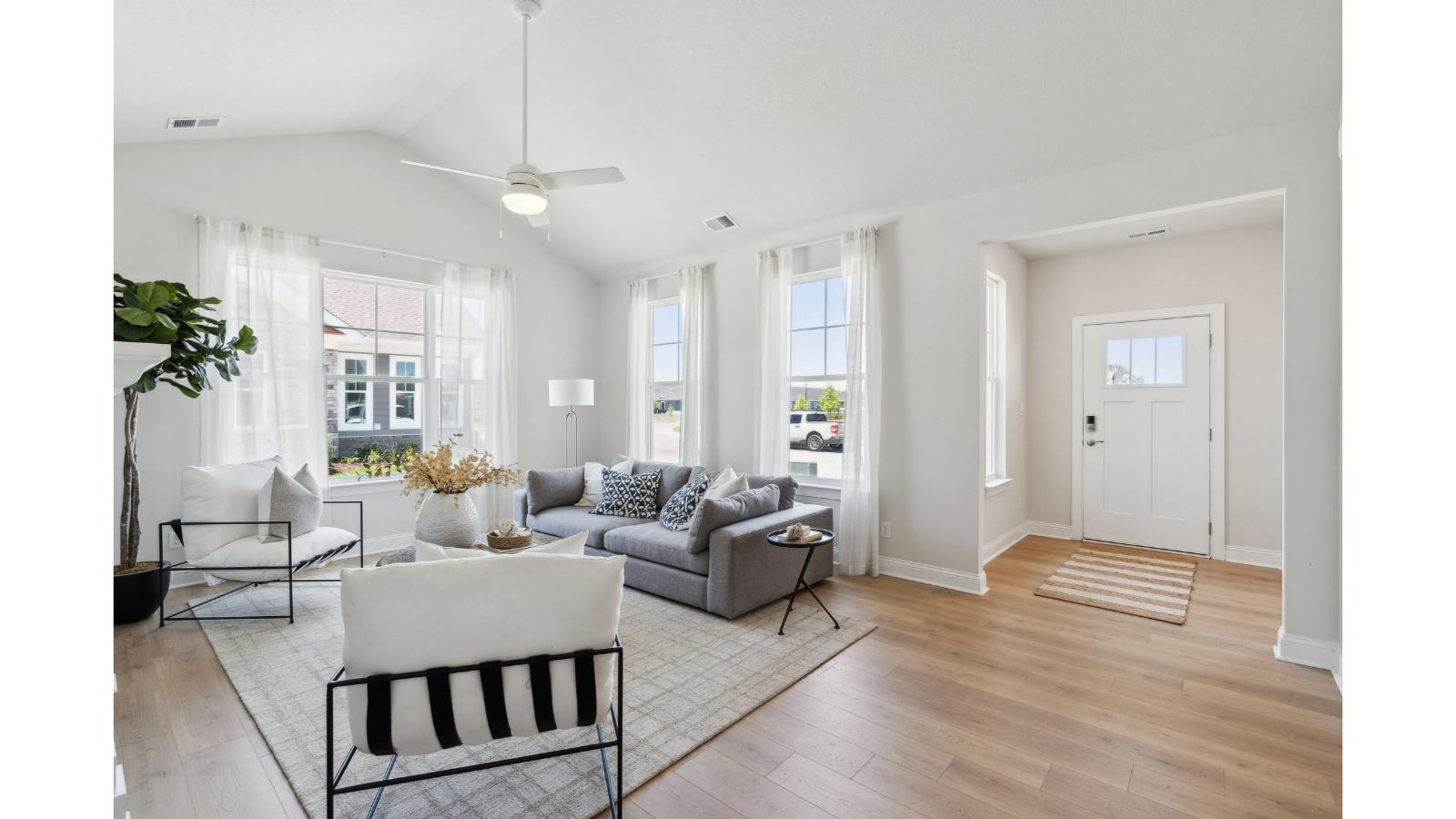Front entry with modern panel door, quality flooring, access to main hallway in Retreat at Edinburgh Farms