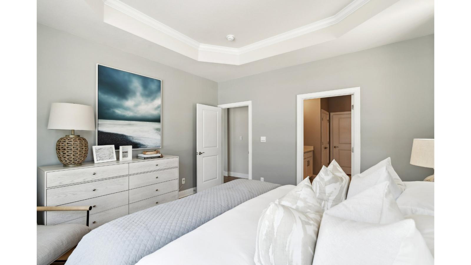 Secondary Bedroom in Retreat at Edinburgh Farms showcases quality flooring, closet space, soft window light, and convenient home access