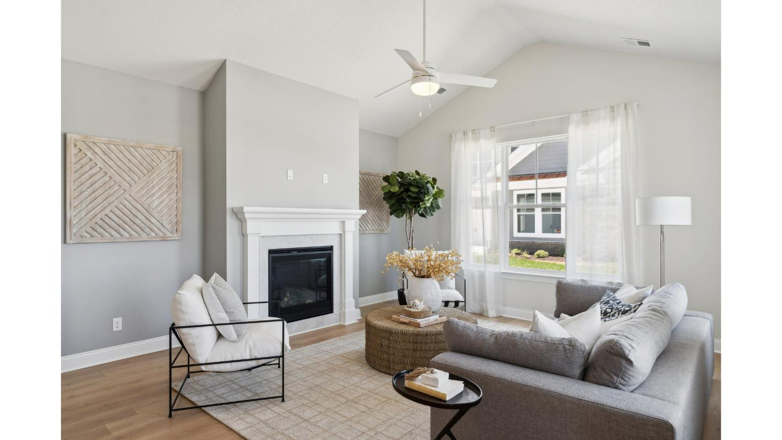 Kitchen island in this New Home includes seamless integration with dining area and Open Concept floorplan