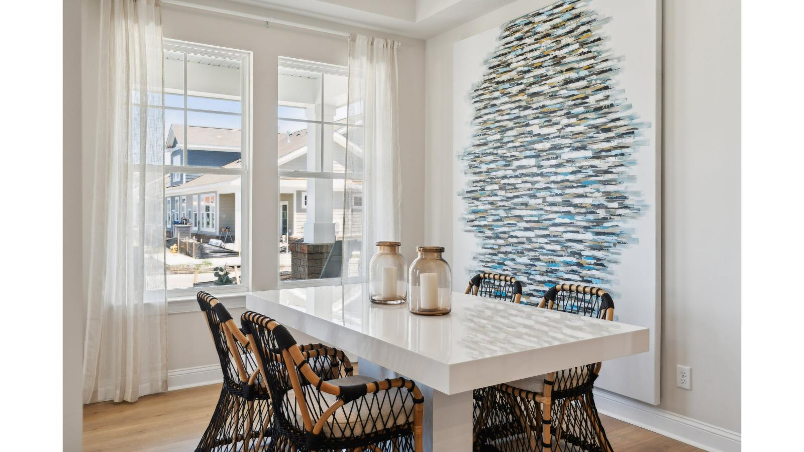 Dining room with natural light, and seamless flow into kitchen and living areas