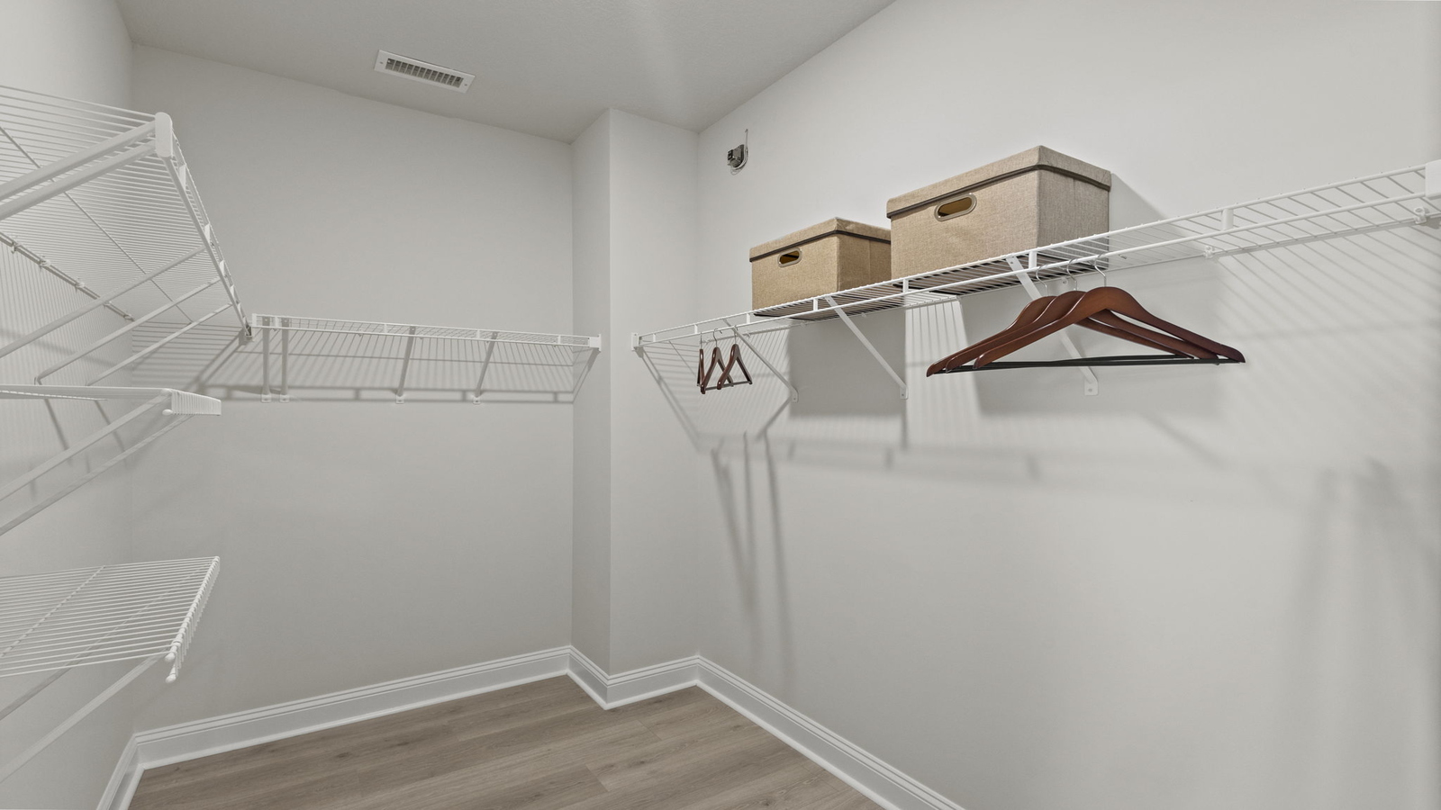 Primary suite closet in D.R. Horton’s Retreat at Edinburgh Farms community showing clean layout, generous storage capacity