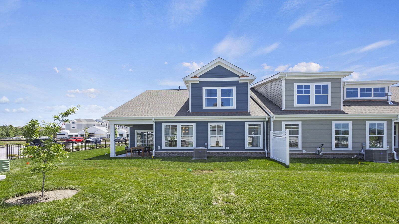 Rear covered patio connected to dining - family room offering outdoor access in this New Construction Home