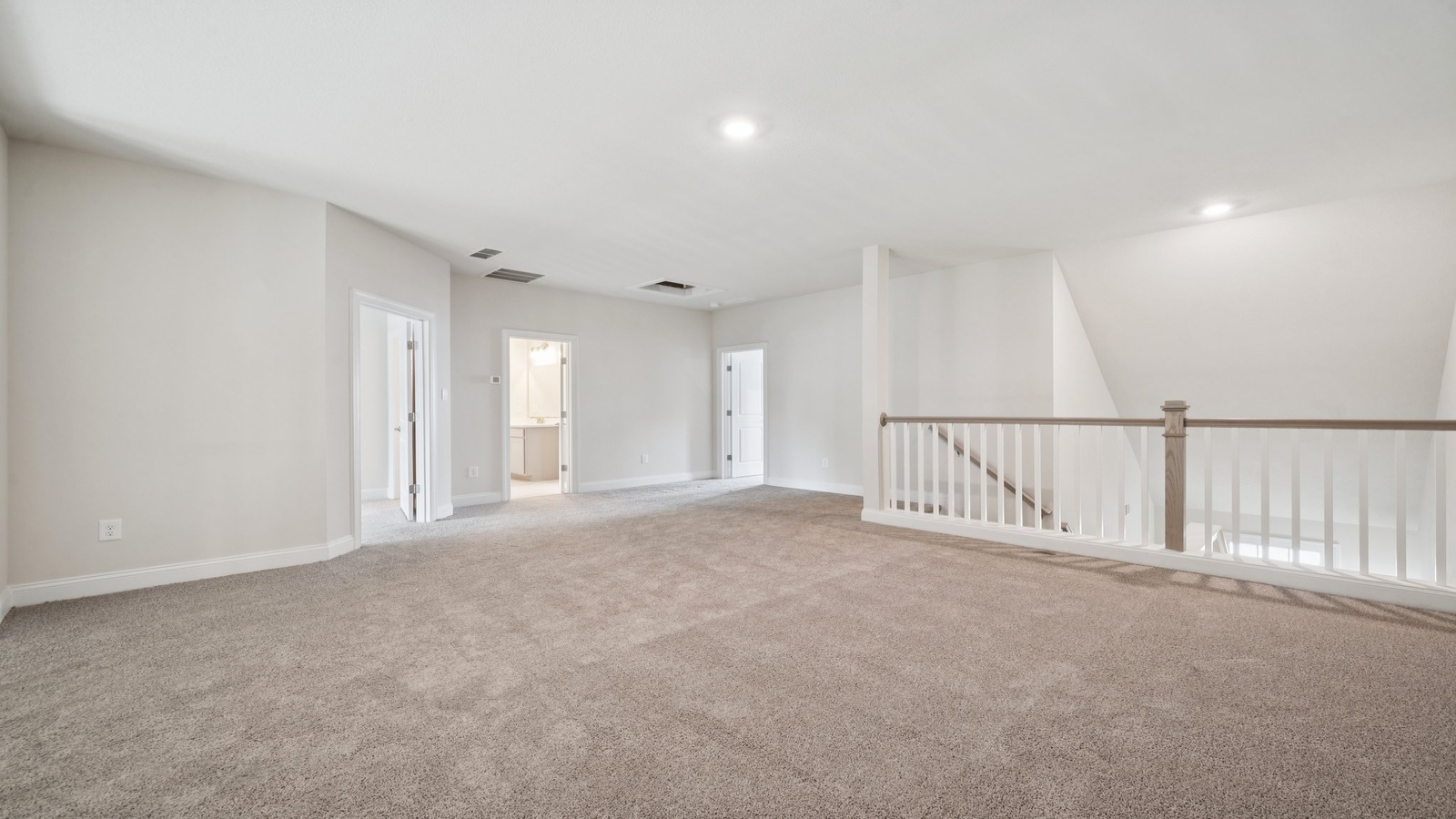 Loft + Secondary Bedroom Open layout upstairs features flowing into secondary bedrooms, bathroom, ideal for multi-use