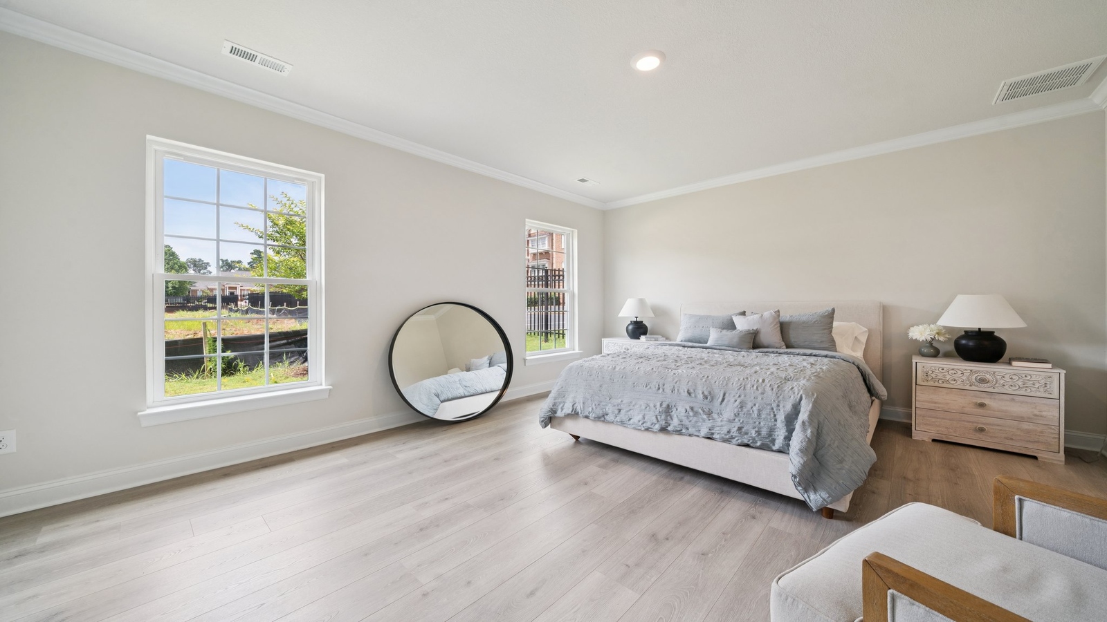 Primary suite at Country Club Villas corner window views, walk-through access to en suite bathroom, walk-in closet