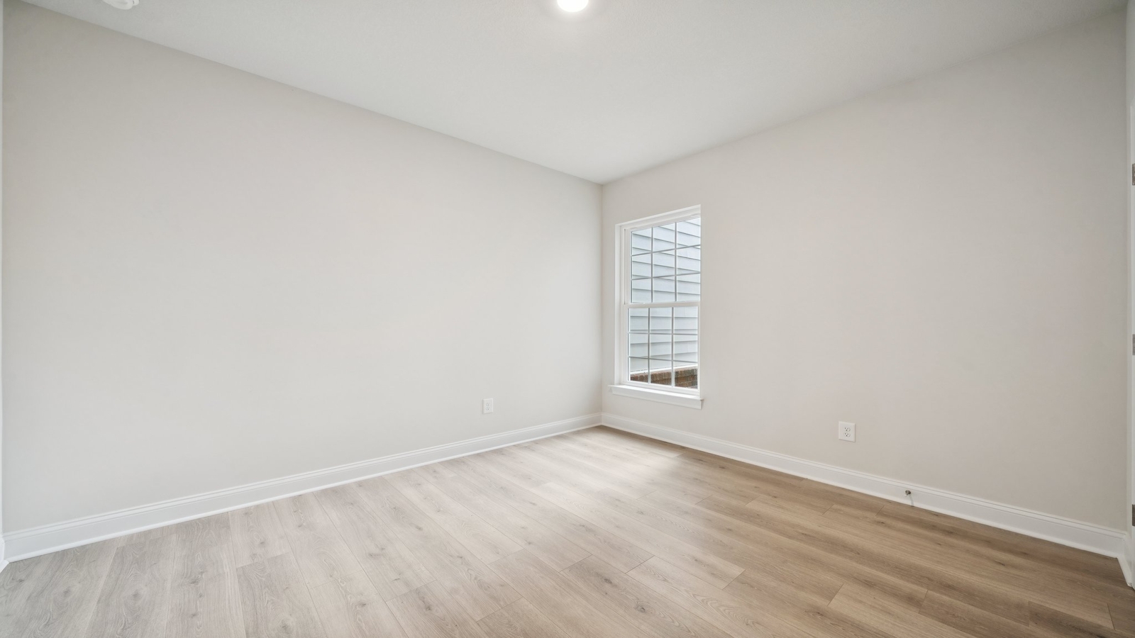 Primary bedroom in this New Home features ample space, double windows, quality carpet, a Walk-in Closet, private En-Suite Bath