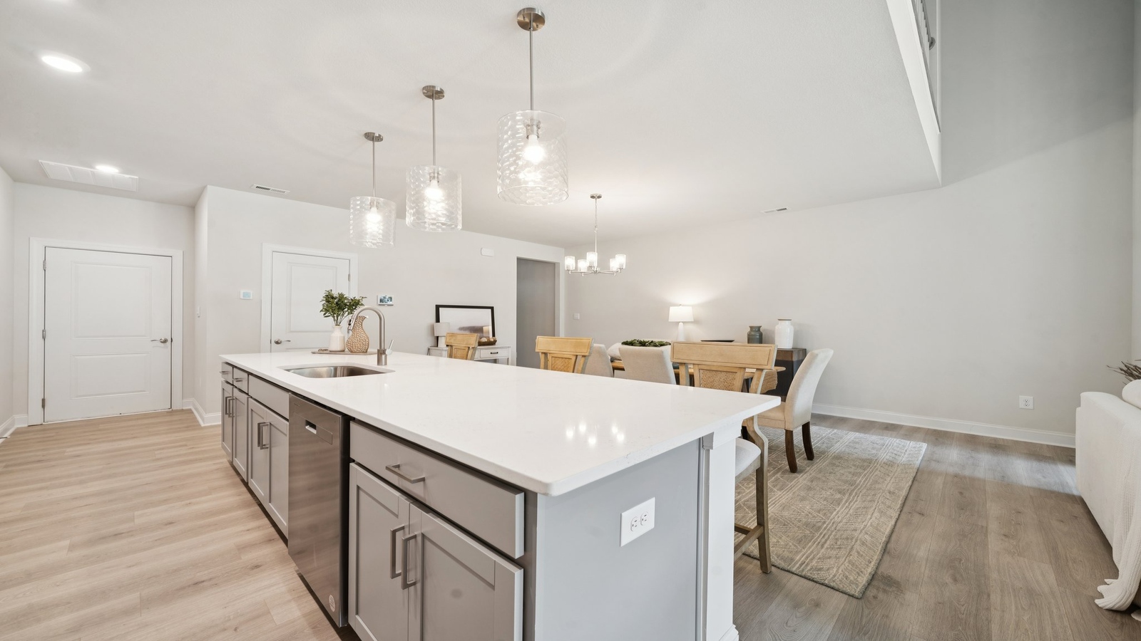 New appliances suite, overhead cabinetry, pantry, island seating in Country Club Villas kitchen-family-dining areas