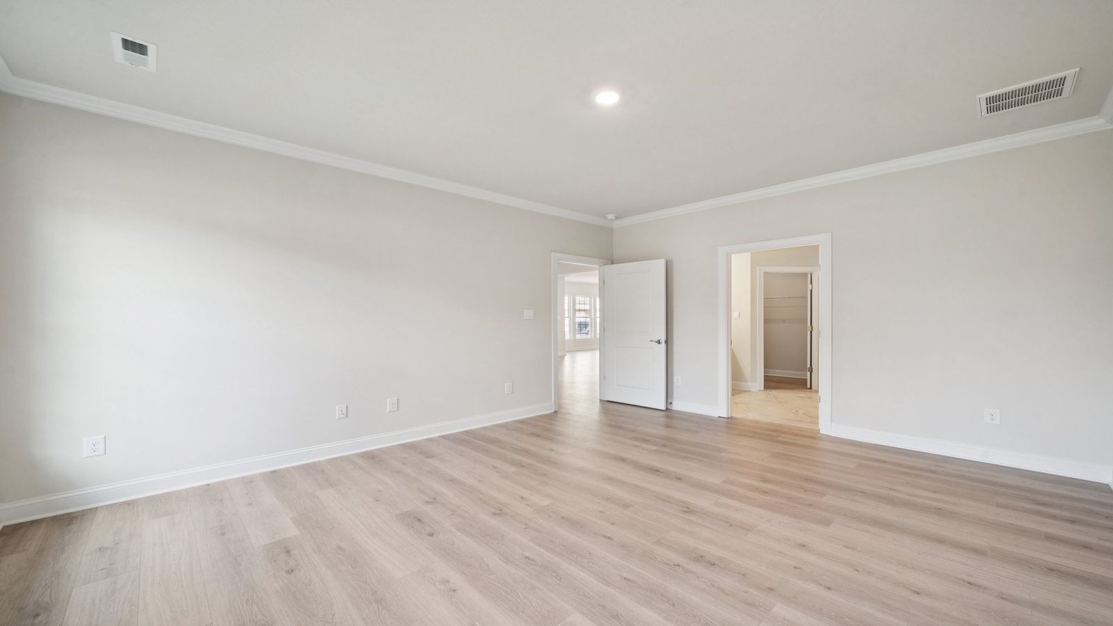 Modern living room in New Home offers backyard visibility, dining and kitchen access Country Club Villas