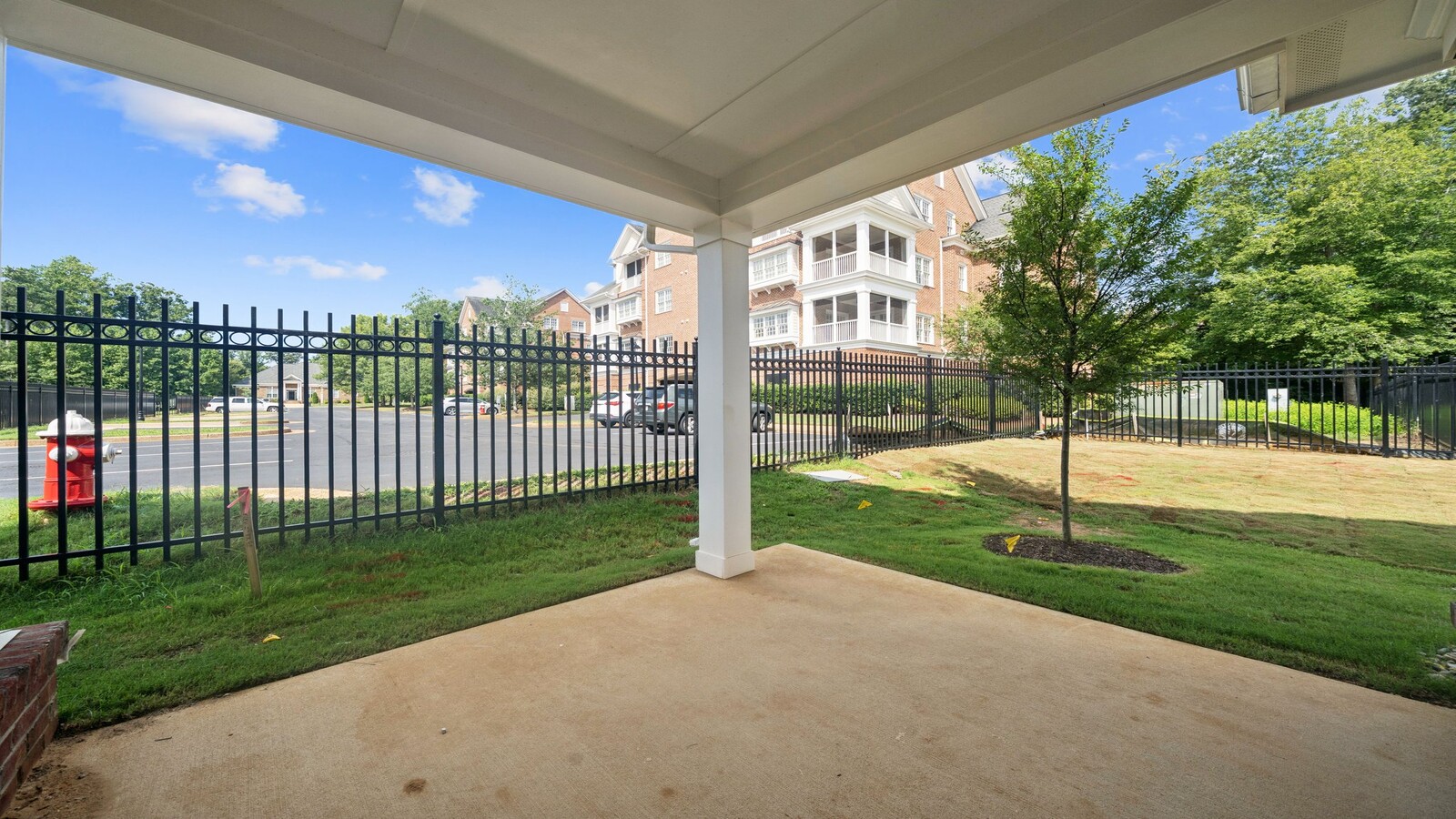 Covered rear patio in this D.R. Horton New Home with outdoor living and private backyard views from the Open Concept layout