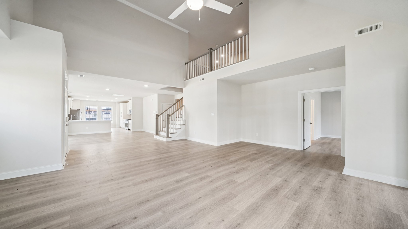 Kitchen, dining, and living areas form one flowing main living space designed for comfort at Country Club Villas