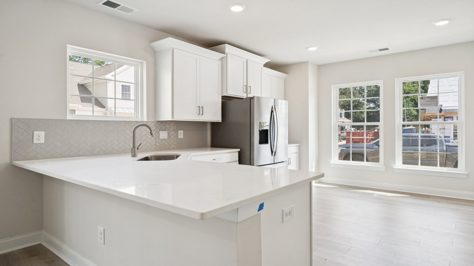 Central kitchen island with dining crafted to anchor the home with pantry, meal prep zones, guest, and everyday gathering