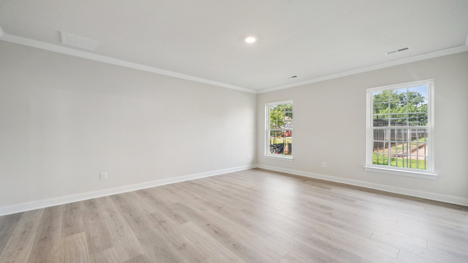 Functional layout with family room looking into modern kitchen and stairwell to upper bedrooms at Country Club Villas