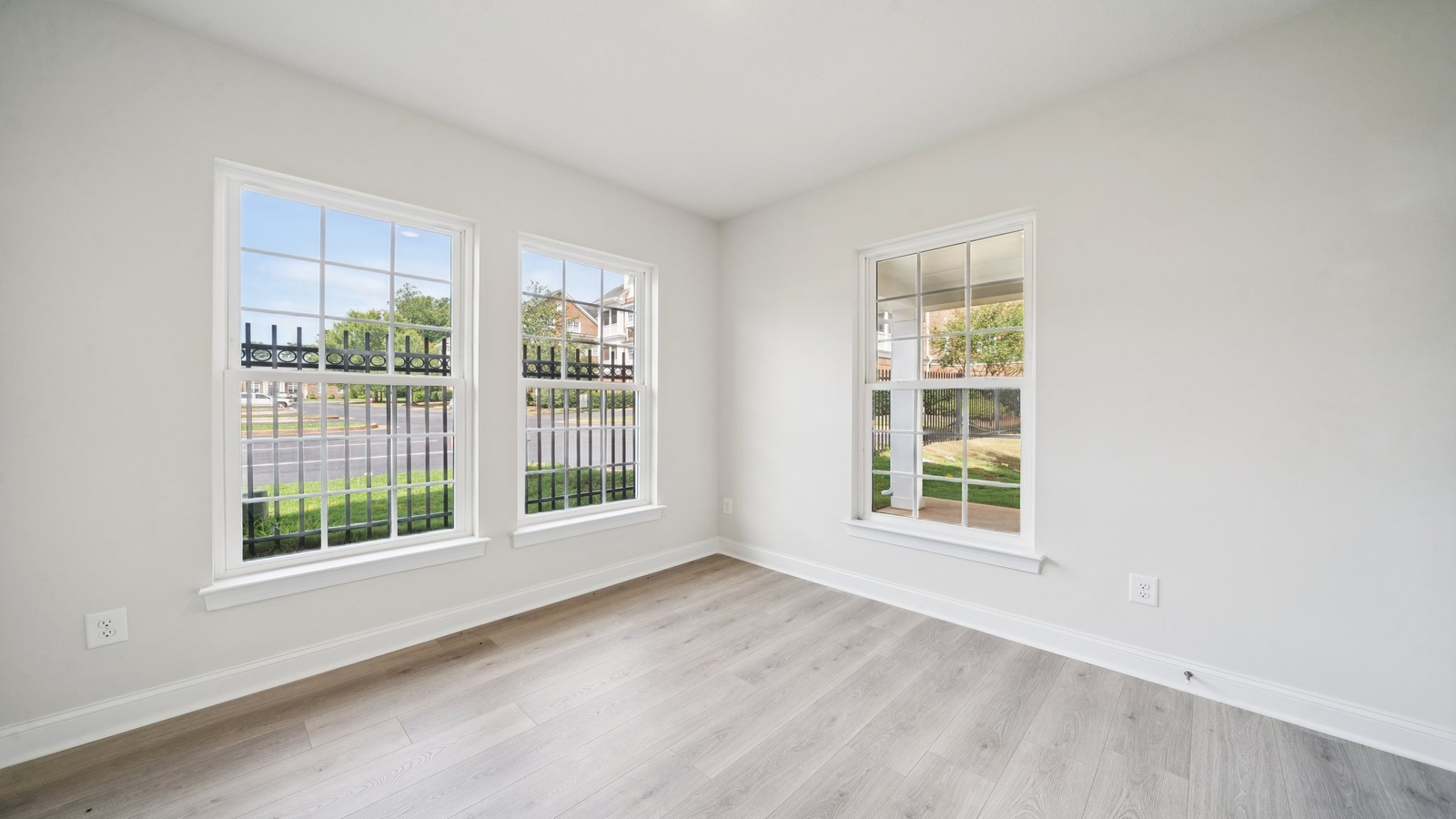 Two-story living room at the front of Country Club Villas home off the main entryway by D.R. Horton