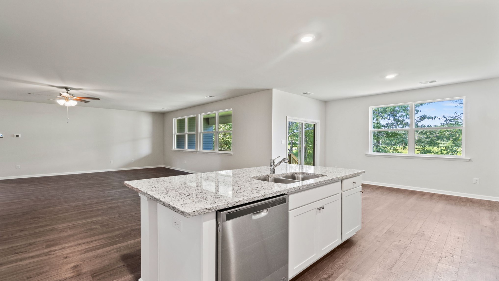 Kitchen-dining-family room combo includes Modern Design elements with wide sightlines and natural lighting throughout.