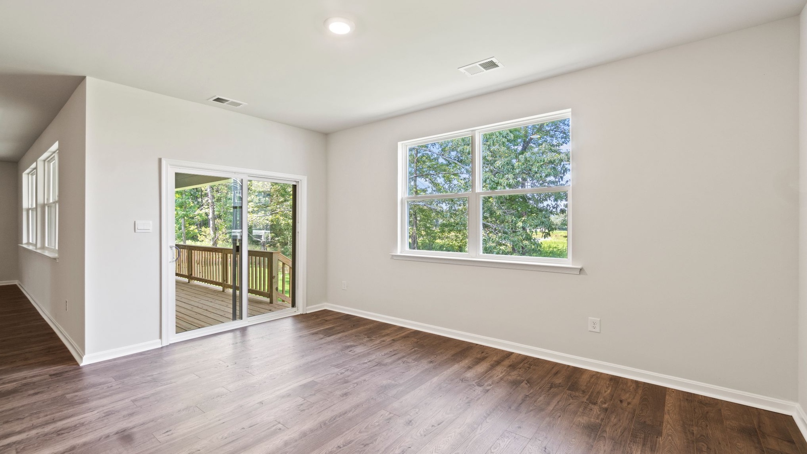 Secondary Bedroom showcases space via single door closet, window, convenient home access Riverview Landing