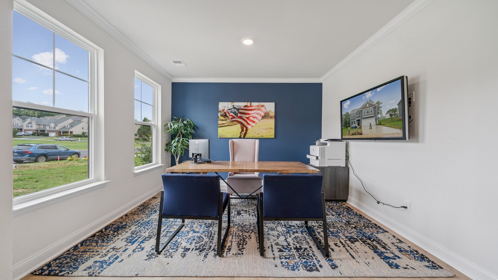 Dining area with nearby kitchen island, backyard view and open-concept plan for entertaining Riverview Landing