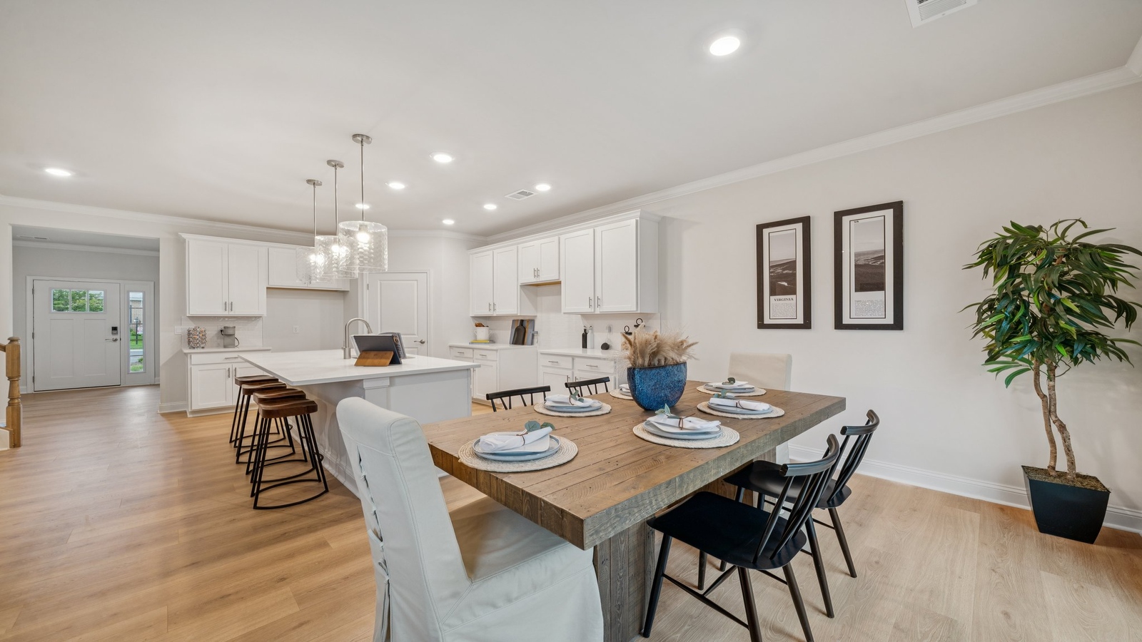 Kitchen-dining-family room combo includes Modern Design elements with wide sightlines and natural lighting throughout.