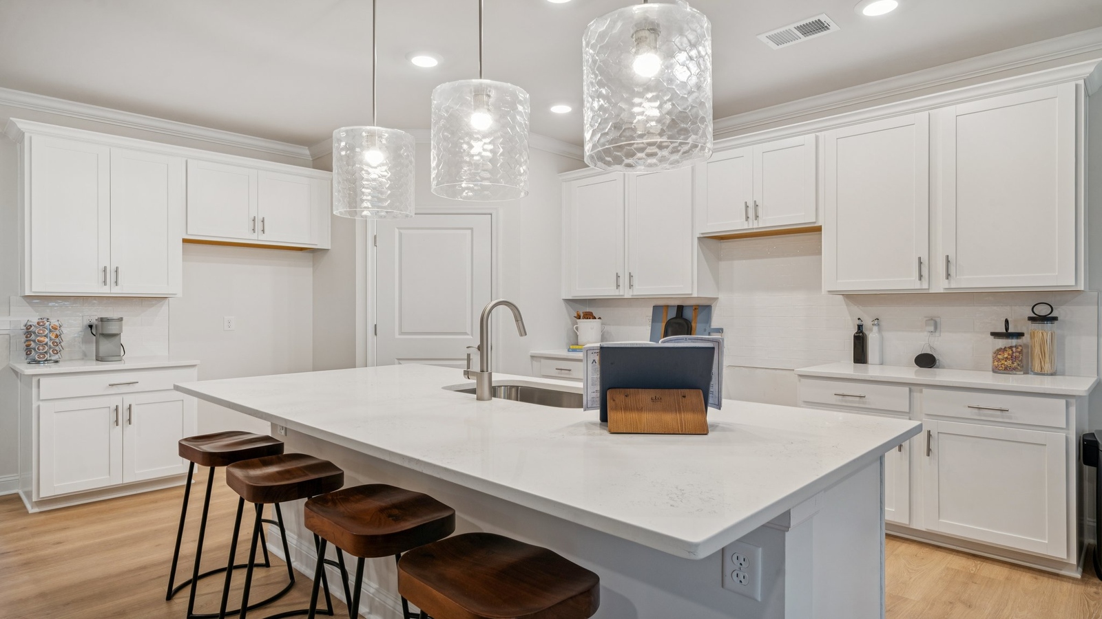 Functional kitchen island with ample storage options including a pantry, and New appliances, prep zones