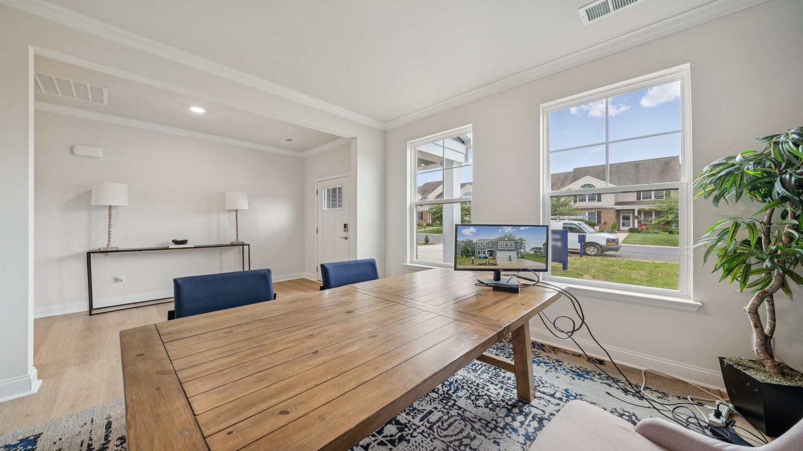 Dining room with natural light, open access and seamless flow into kitchen-living areas