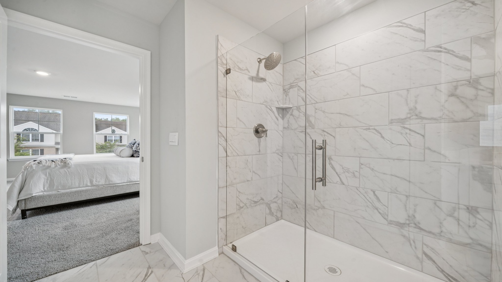 New Home showcases a D.R. Horton ensuite bathroom with quality upgrades, open layout to shower-tub, and walk-in closet