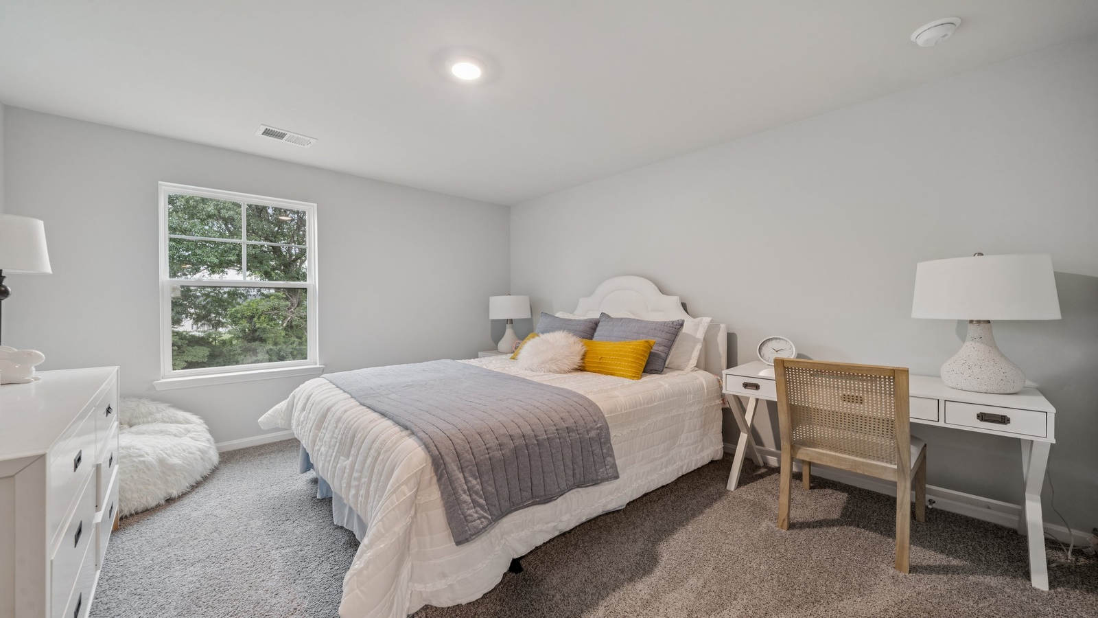 Secondary Bedroom showcases space via single door closet, window, convenient home access Riverview Landing