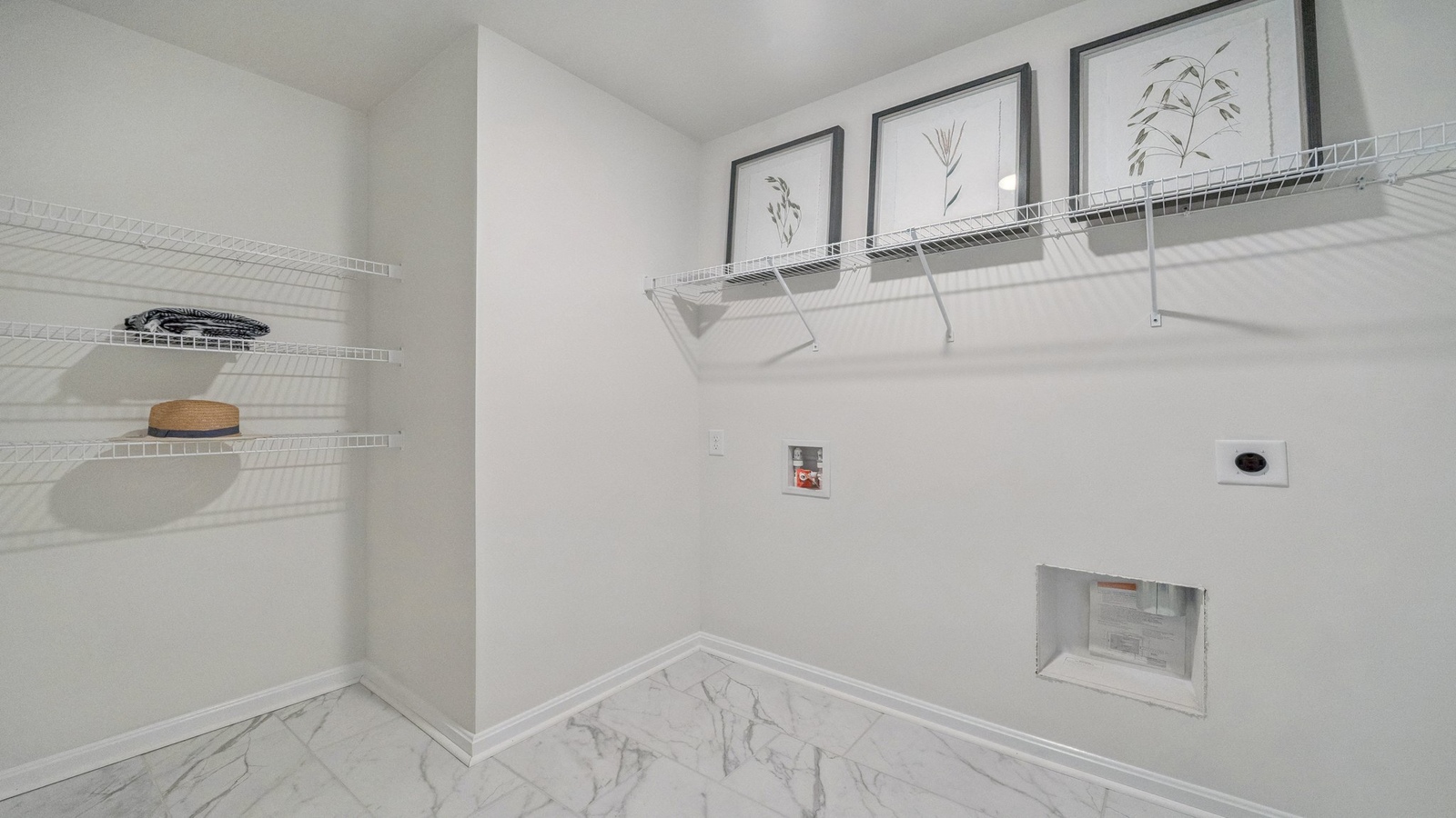 Smartly designed utility laundry in Riverview Landing with new washer dryer, overhead storage