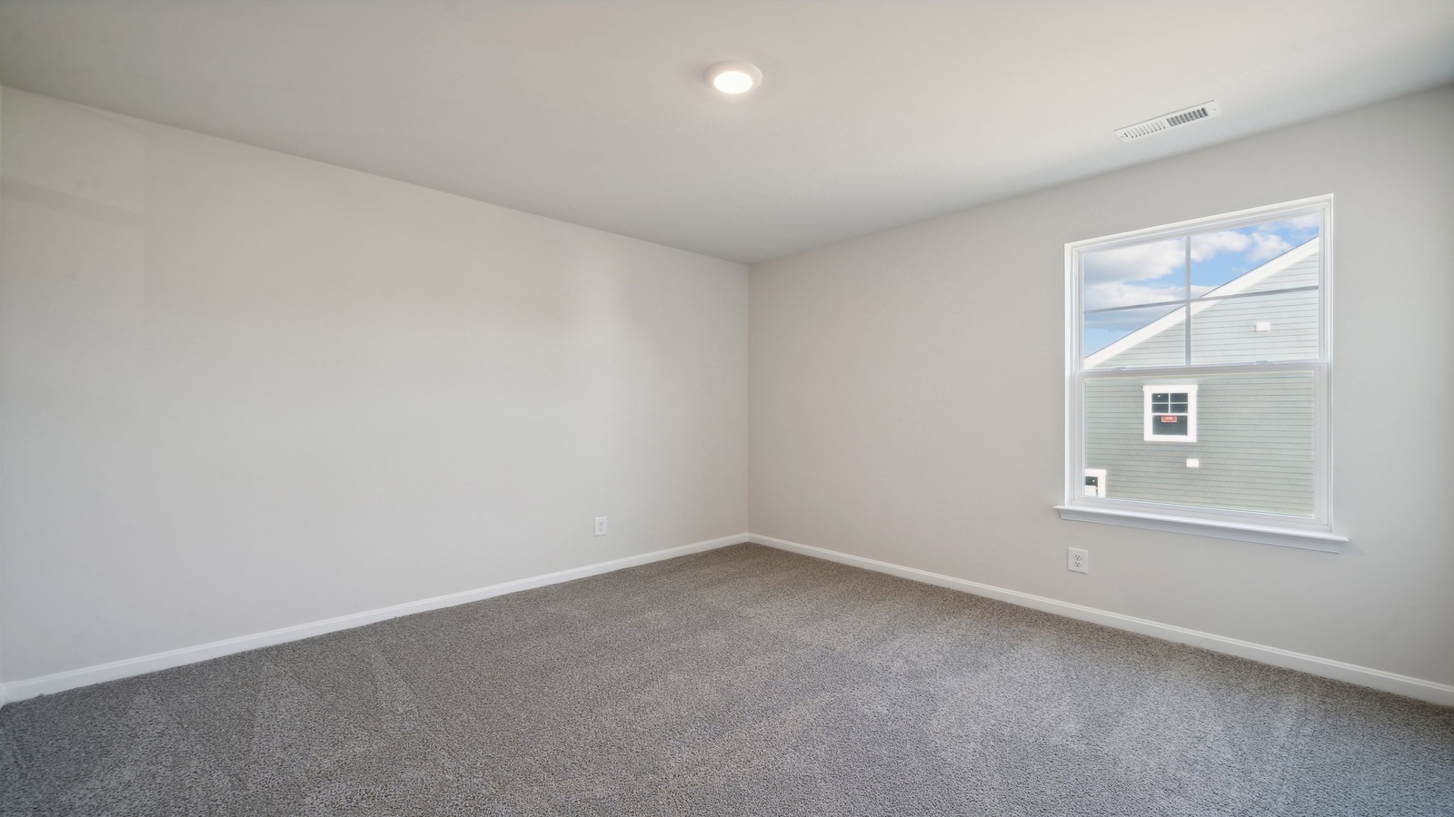 Primary bedroom in this New Home features ample space, double windows, quality carpet, a Walk-in Closet, private En-Suite Bath
