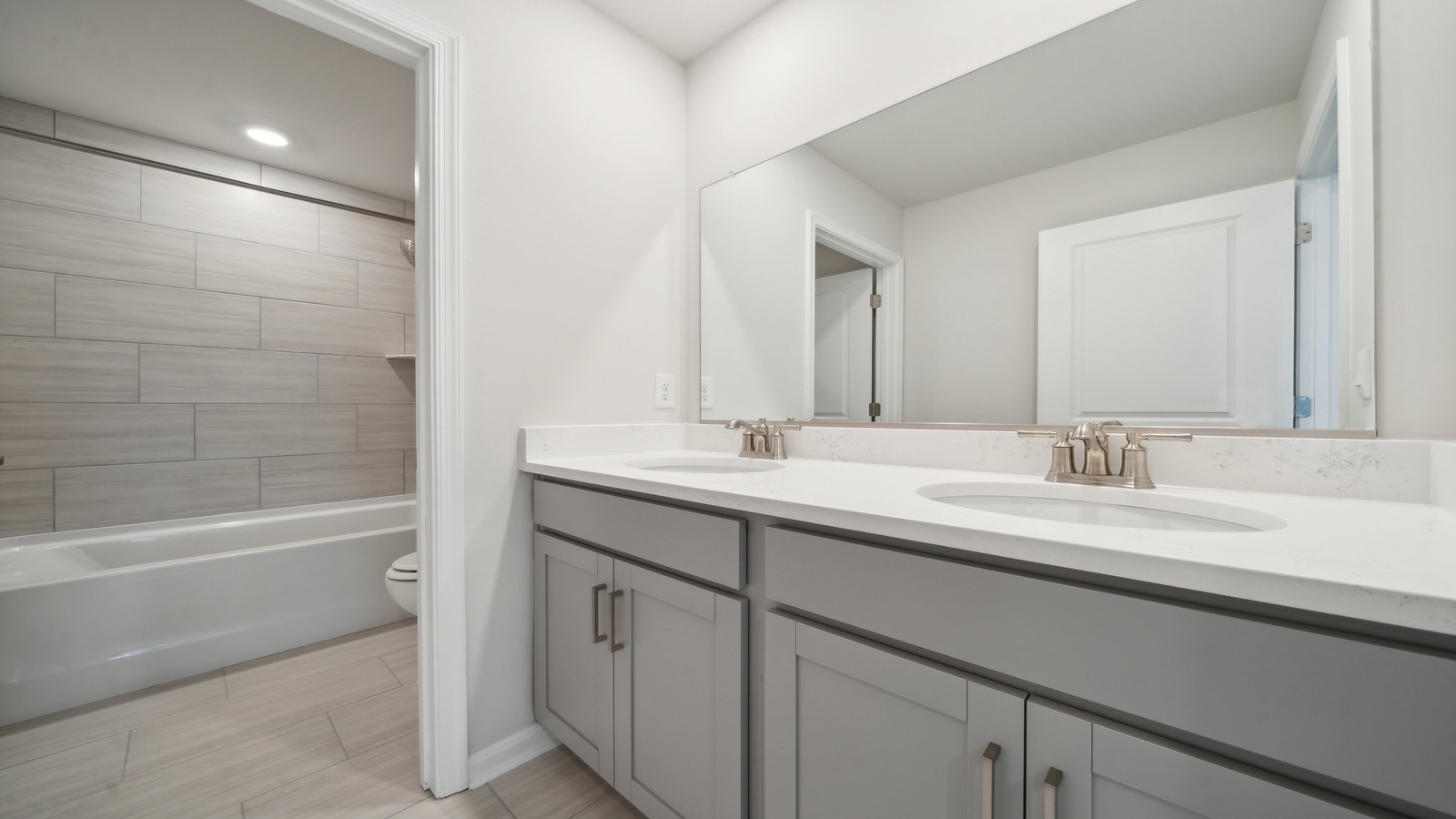 Full secondary bathroom with tub - shower combo, vanity, with fresh designs at Riverview Landing