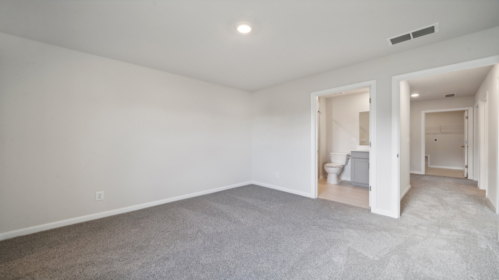 Secondary Bedroom features a traditional closet, quality carpet, and a spacious room arrangement for flexible space design