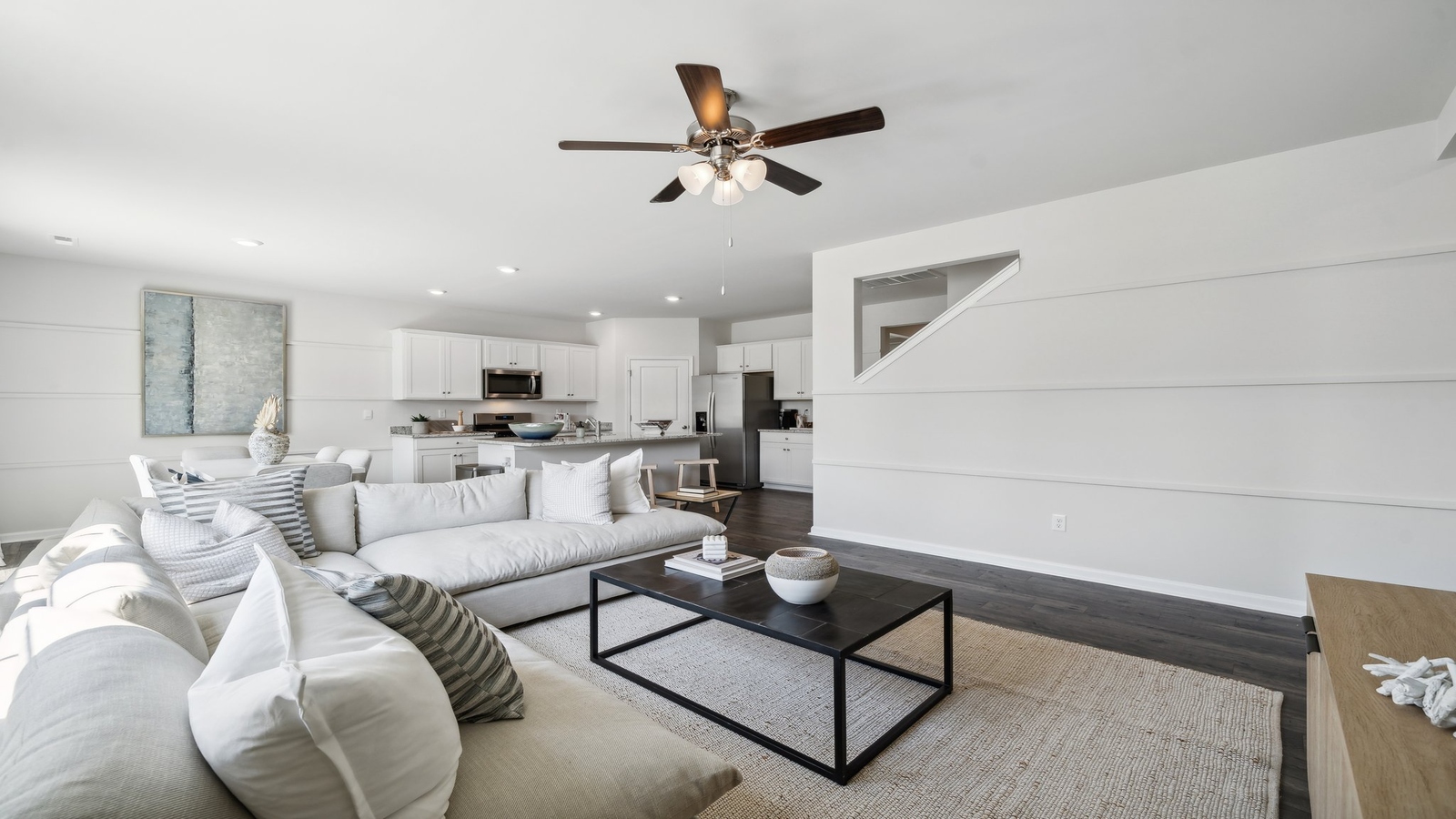 Living room with modern design accents, front views, and convenient traffic flow throughout Bennetts Pasture