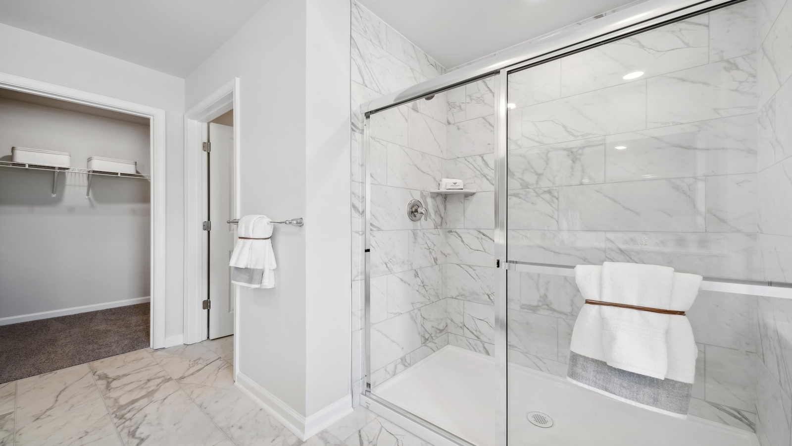 New Home showcases a spa-inspired ensuite bathroom with quality upgrades, open design to shower-tub, and walk-in closet