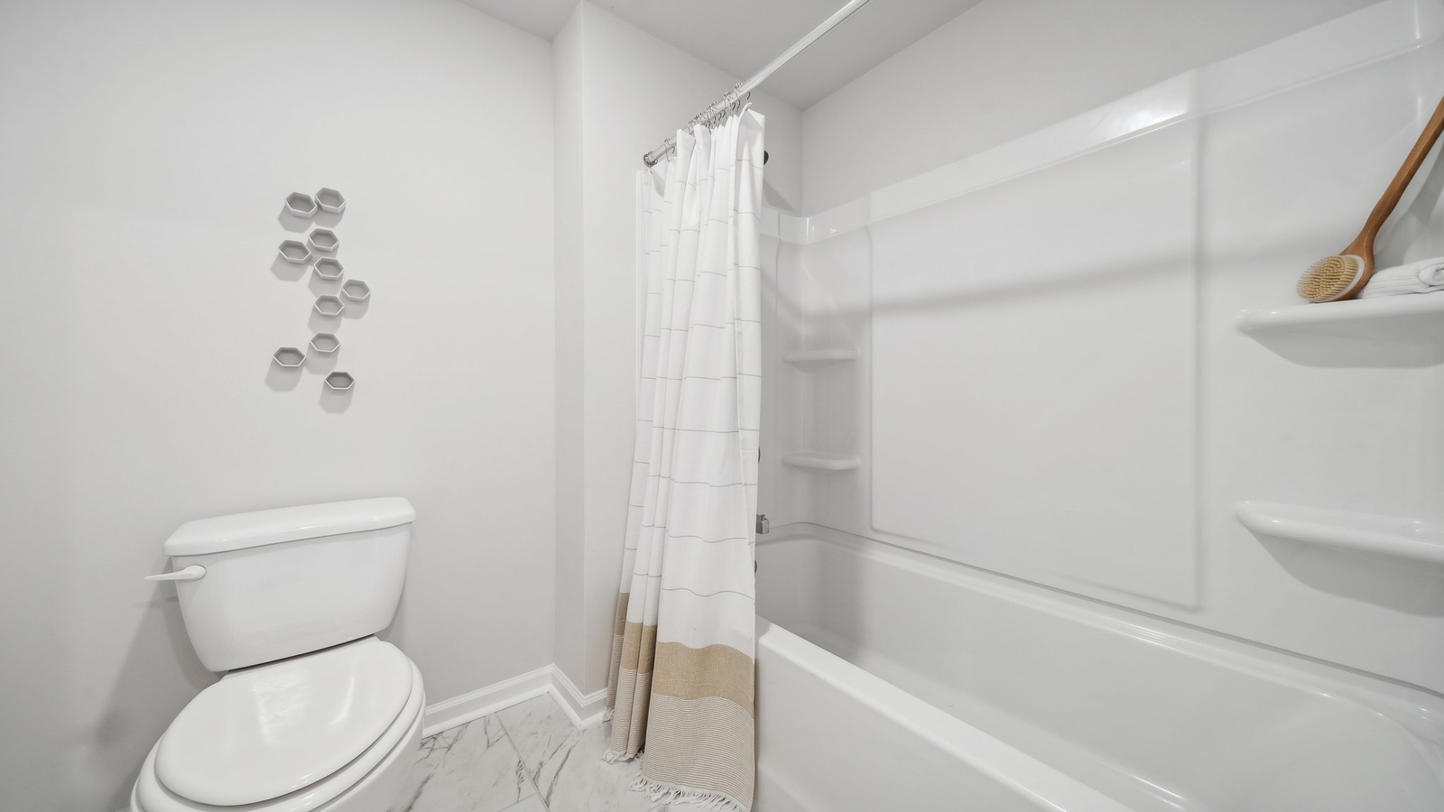 Full bathroom with combo step-in tub-shower and storage vanity