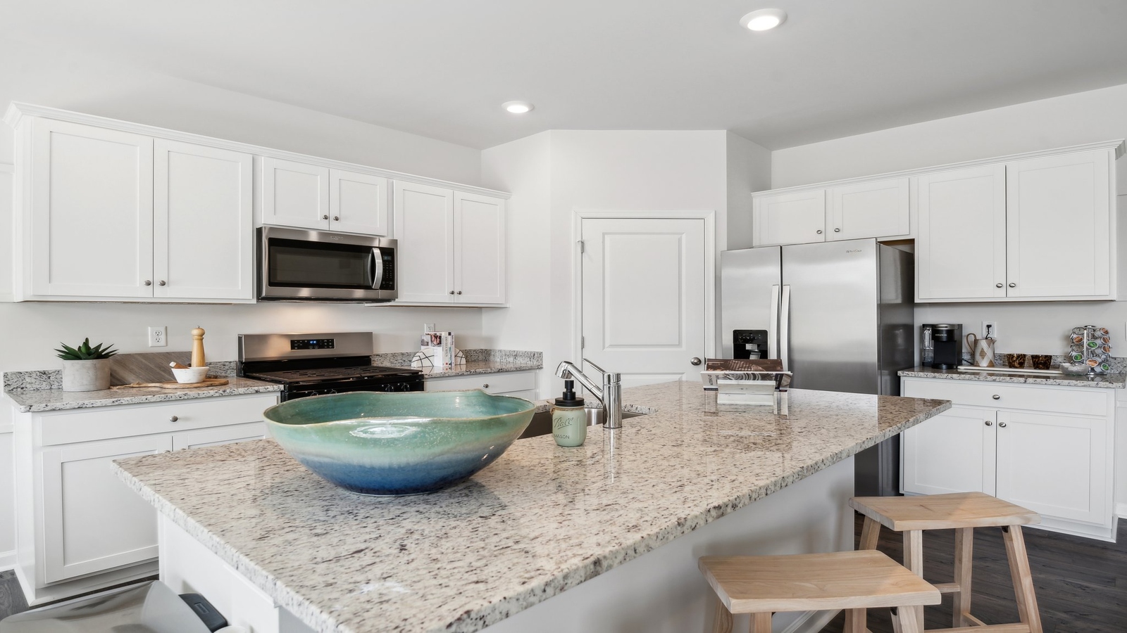 Spacious Kitchen island in this New Home, ideal for dining, daily prep zones, and entertaining in our fresh modern design layout