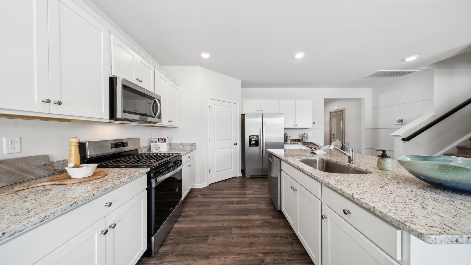 Bennetts Pasture's kitchen island includes a seamless design with dining-living areas in an open concept plan
