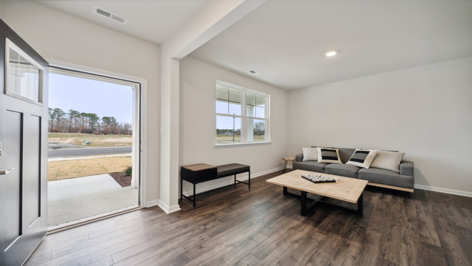 A foyer and entry hall combination features a welcoming front with a direct line of sight through the main living areas