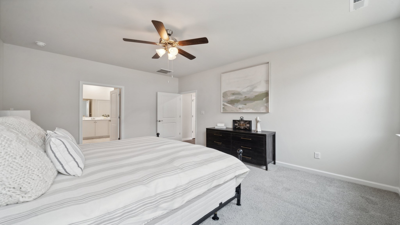 Owner’s suite offers natural window light, a spa-inspired ensuite bathroom, and a walk-in closet for everyday comfort Bennetts Pasture