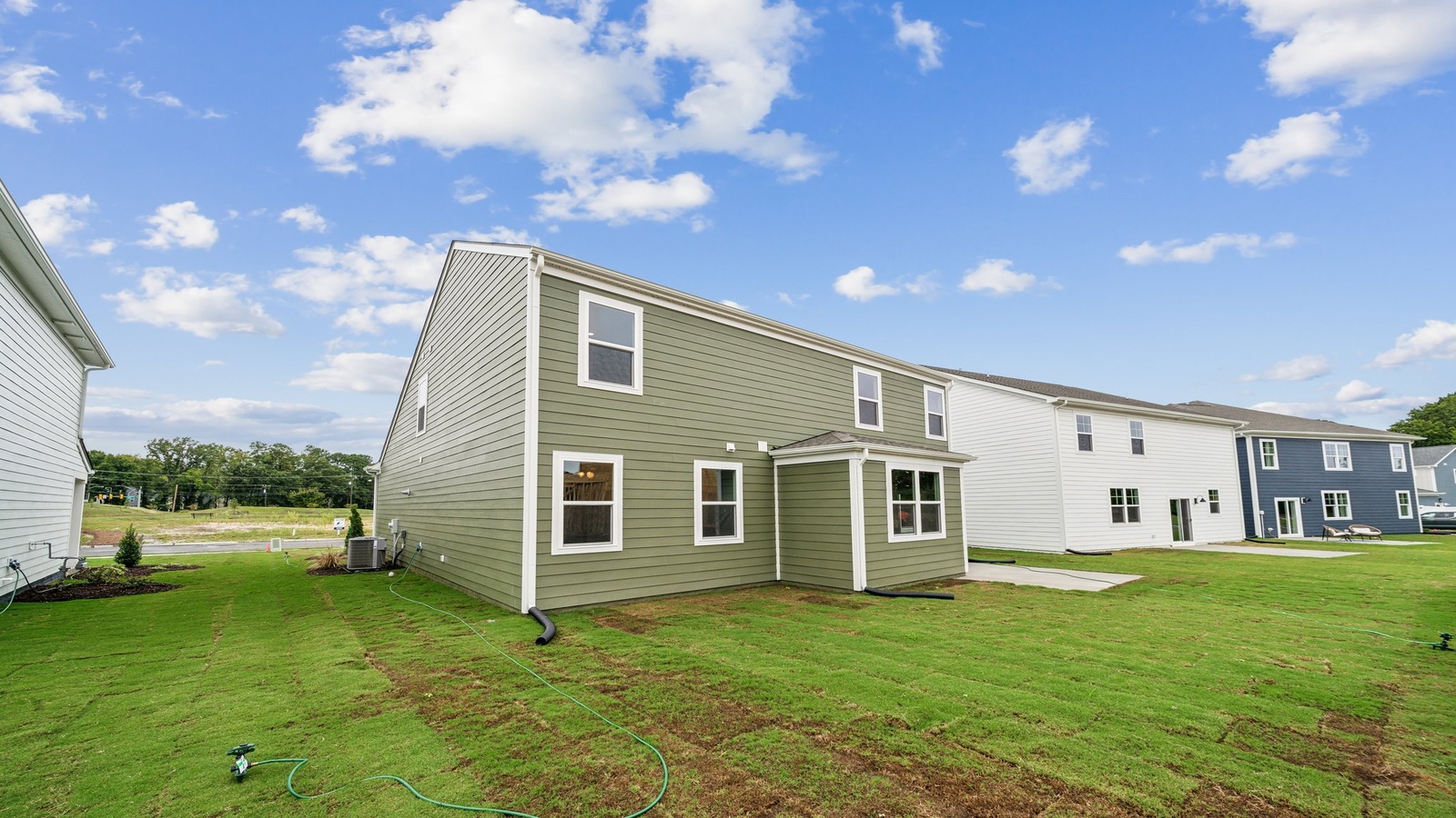 New House by D.R. Horton featuring concrete patio for outdoor entertaining and a backyard space ideal for gatherings