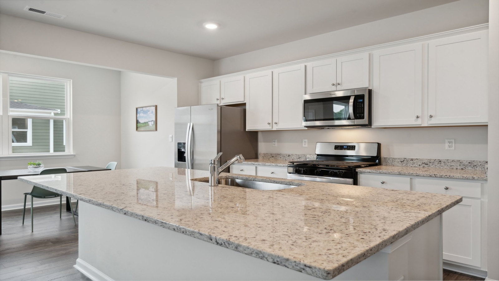 Sleek kitchen design with new appliances, Pantry, cabinet options and island breakfast bar in Bennetts Pasture