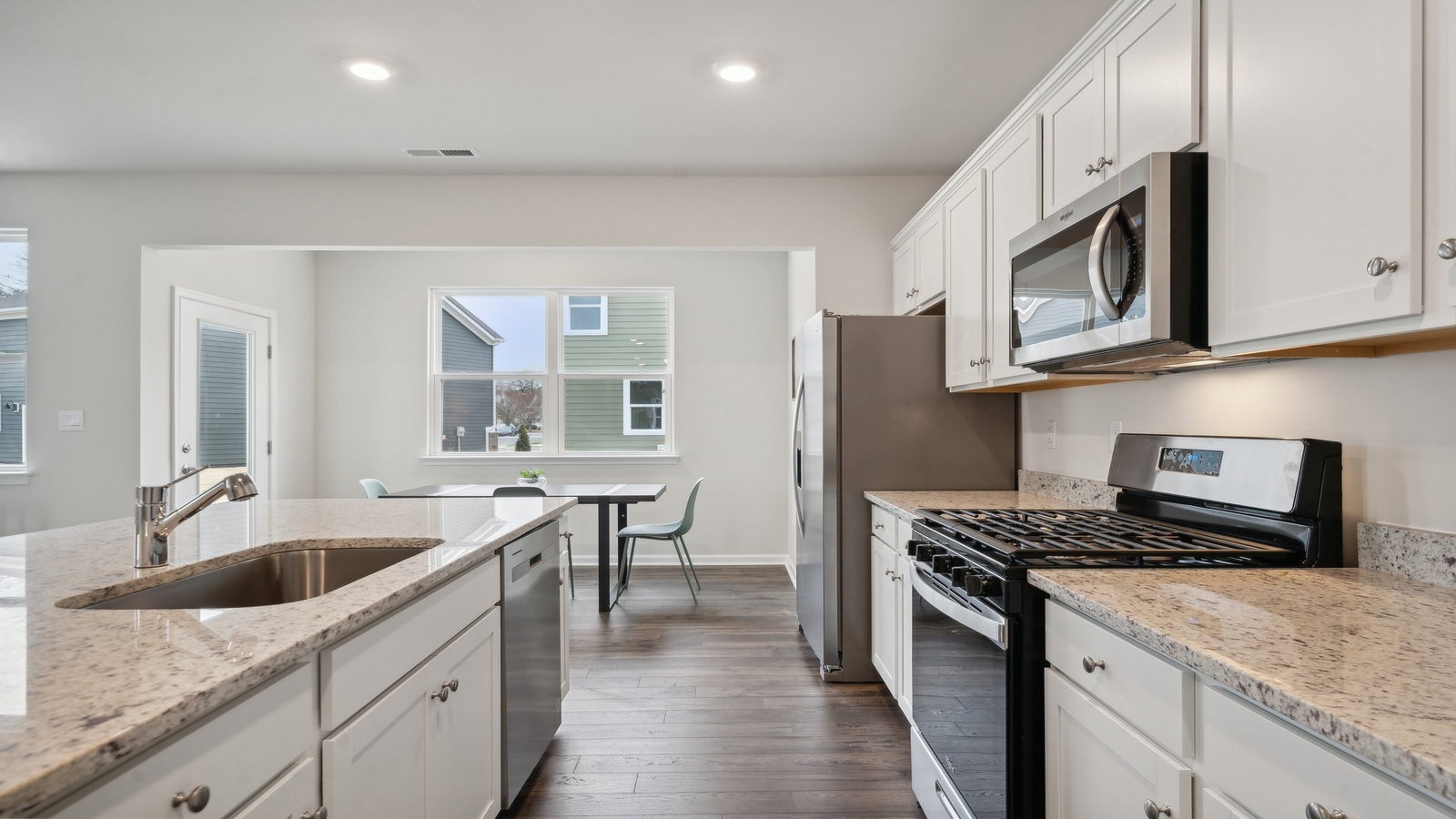 New appliances suite, cabinetry options, pantry, prep zones, island seating, Bennetts Pasture kitchen-family-dining area