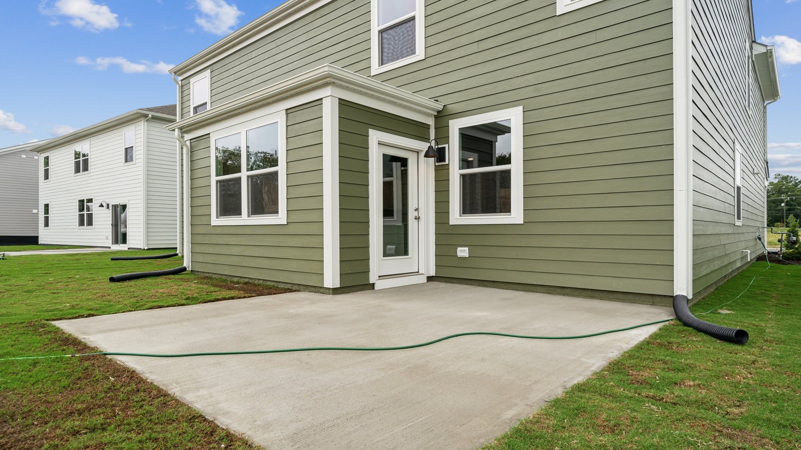 New house by D.R. Horton featuring paved patio for outdoor entertaining and backyard space ideal for gatherings